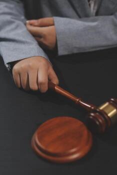 A judge's gavel on a black background photo