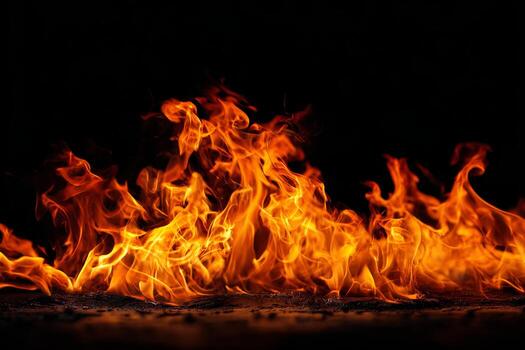 A realistic photo of fire flames with illuminated edges on a black background.