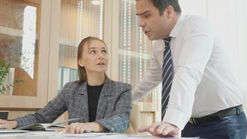 Business team meeting about report analysis statistics and profit of financial, manager and secretary consulting and planning of finance with chart and graph document. video