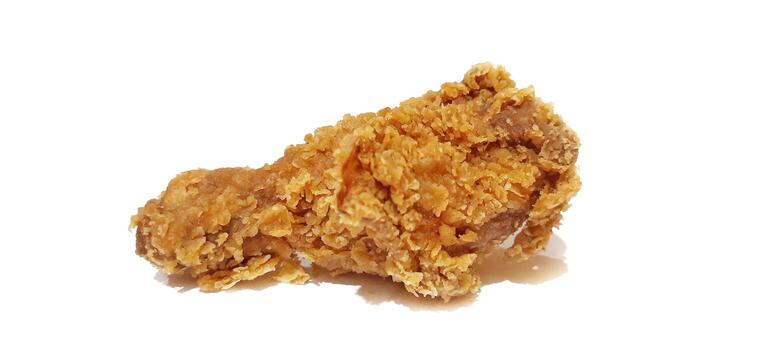 Delicious Crispy Fried Chicken Drumstick on White Background. Selective Focus photo