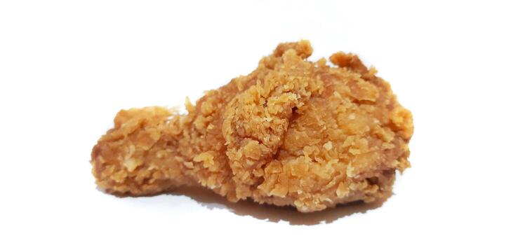 Close-Up of Crunchy Fried Chicken Drumstick on White Background photo