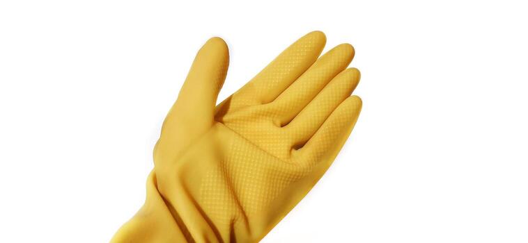 Hand gesture in yellow rubber glove showing stop five fingers, palm gesture isolated on a white background photo