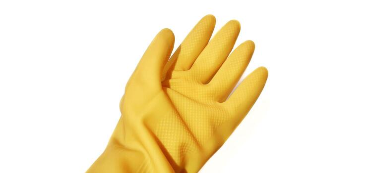 Yellow rubber gloves isolated on white background. Clipping path included. photo