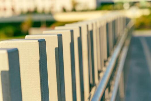 Modern railing design with geometric patterns and soft sunlight casting shadows, enhancing architectural aesthetics and outdoor ambiance in a contemporary setting photo