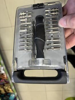 Toolset with various screwdriver bits and a handle, displayed in a transparent case, showcasing versatility and organization for DIY enthusiasts and professionals alike photo