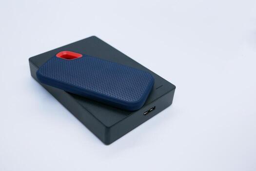 Two External SSD and HDD Drives on White Background. photo