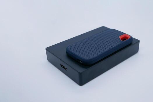 Two External SSD and HDD Drives on the White Background photo