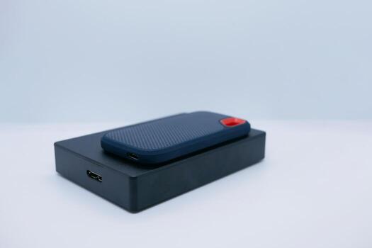 Two External SSD and HDD Drives on White Background photo