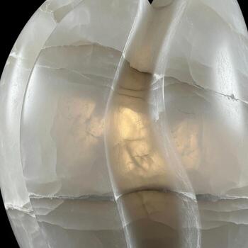 Abstract close up of a translucent curved surface with subtle internal lighting and a central diagonal element creating a sense of depth and mystery photo