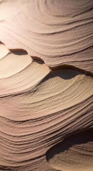 Abstract close up of stacked paper pages creating organic wave like patterns and soft shadows with warm lighting photo