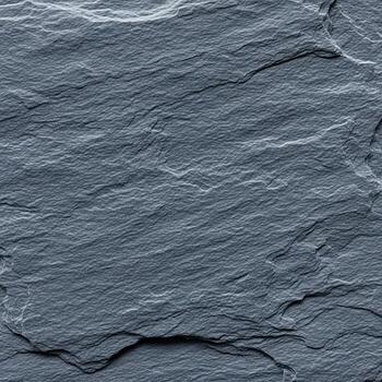 Close up textured surface of dark grey slate stone with natural rough layered patterns and subtle variations photo