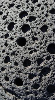 Close up view of the textured surface of the moon showing numerous impact craters of varying sizes and depths photo
