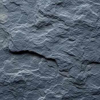 Close up textured abstract background of dark gray and blue slate rock with rough uneven surfaces and natural geological patterns photo
