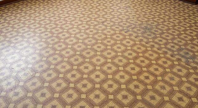 A room with a floor that has a pattern on it photo