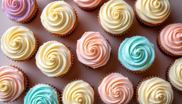 Pastel cupcakes arranged in a minimalist composition, topped with creamy buttercream rosettes. photo