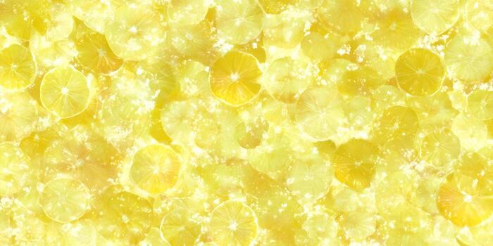 Numerous sparkling bright yellow lemon and lime slices create a vibrant refreshing background photo