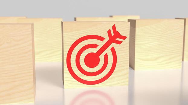 A red target on a wooden block with a dart in the middle photo