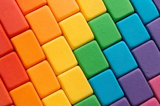 Colorful pastel blocks arranged in a rainbow pattern create a vibrant and cheerful display suitable for crafting and play photo