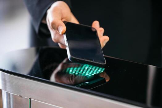Individual using smartphone to access secure entry system, demonstrating modern technology with sleek design and illuminated interface, showcasing convenience and innovation photo