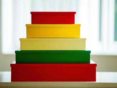 Colorful Stacked Boxes in Yellow, Red, Green, and White Arrangement on Display photo