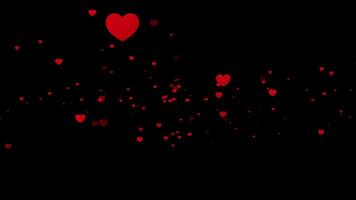 hermosa rojo corazón partículas flotante y centelleo en un oscuro antecedentes lazo video