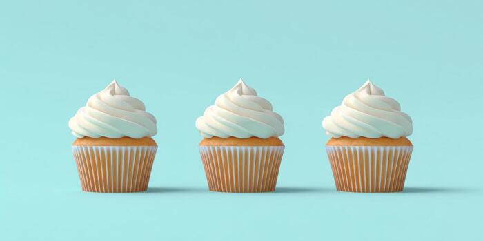 Trio of delicious cupcakes with whipped cream frosting on blue background photo