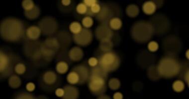 Golden luxury bokeh on particles floating in the air. Dust and glitter particles background. Black background , Loop Animation video