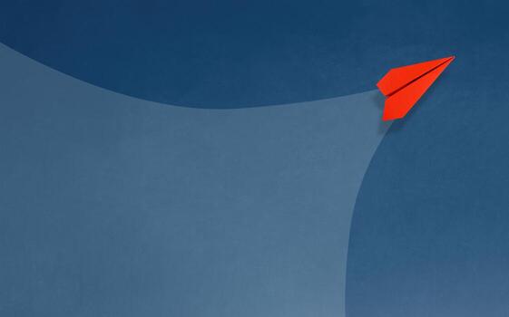 An image of a red paper airplane flying while creating a new path. photo