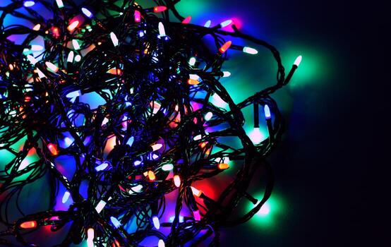 Pattern of Twisted Cables of Glowing LED Garland Close Up View Stock Photo