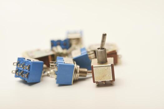 Miniature toggle switch. Electronic component close-up. photo