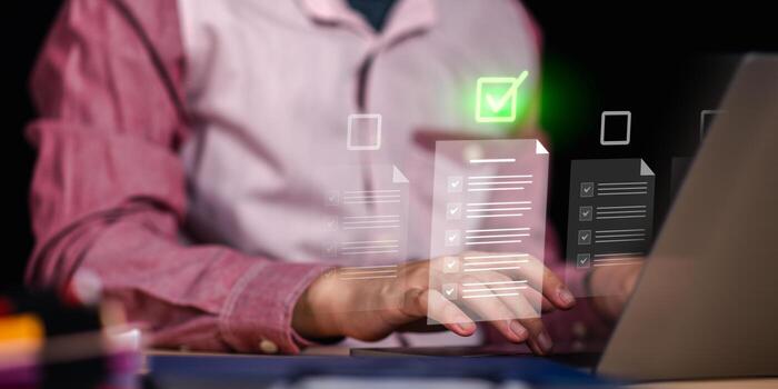 Digital document audit and verification checklist on laptop. Concept of business management, compliance, and quality assurance for corporate process control and data accuracy in modern office systems photo