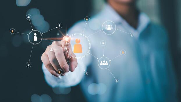 business professional selecting a digital network icon representing human resources connection, recruitment process, talent management, smart HR analytics for workforce and organization development. photo