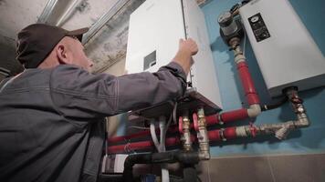 Plumber Programming Digital Display on Heating System video
