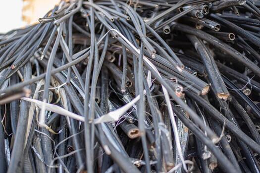 Solid background of wire wrapping after non-ferrous metal processing. WEEE e-waste is a type of waste containing discarded electronic and other electrical devices and parts thereof. High quality photo