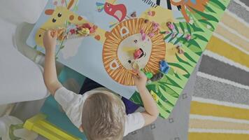 Toddler creating animals with modeling clay at home video
