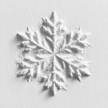 A snowflake is made from powder on a white surface photo