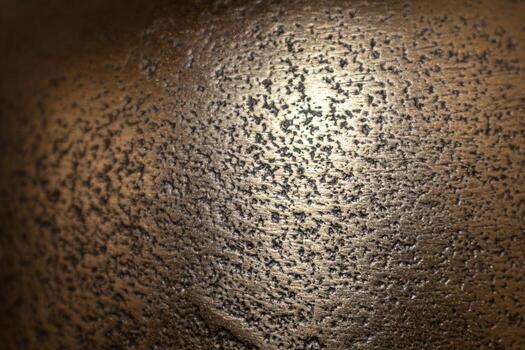 Golden background of an authentic image of an object, zoom on its texture for background and concept, metal photo