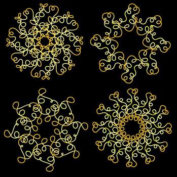 A set of abstract patterns in the form of golden snowflakes on a black background vector