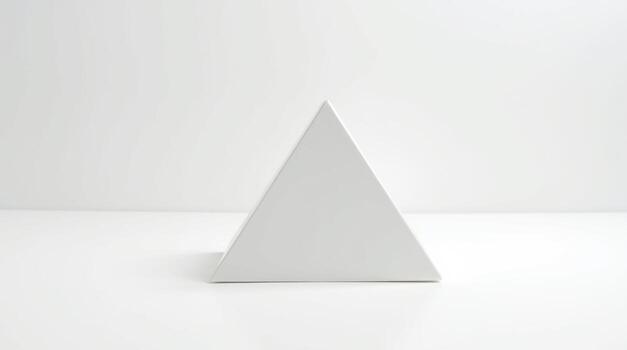 a white triangle shaped object on a table photo