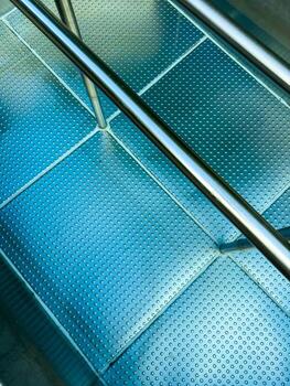 Reflection of modern design in a subway station with metallic textures and cool hues creating a unique visual experience for commuters photo