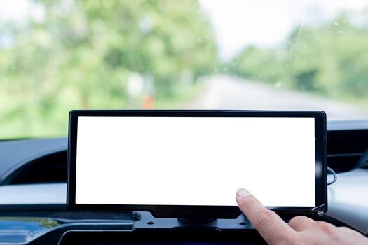 Close up of hand touching car navigation screen with blank white display inside vehicle, concept of GPS, driving technology, digital interface, and modern transportation system background. photo