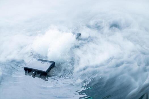 Fog Generator is modern technology device submerged in water with steam and bubbles rising, symbolizing innovation, waterproof design, and durability in extreme environmental conditions. photo