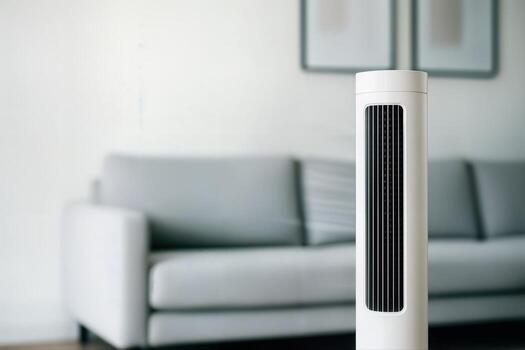 Fan Providing Heat Wave Relief in a Modern Living Room with a Blurred Sofa in the Background and a Minimalist Indoor Setting photo