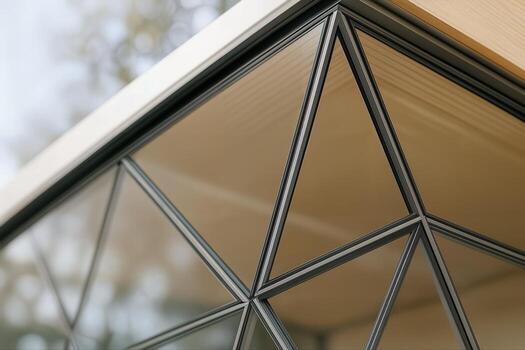 Glass Pavilion Design Featuring Angular Architectural Patterns in an Outdoor Setting with Natural Light and a Minimalist Aesthetic photo