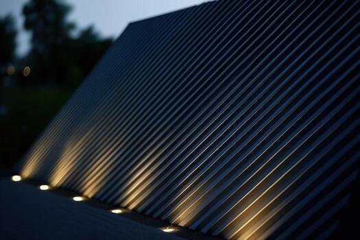Louvered Metal Structure Illuminated Outdoors at Dusk with Soft Gradient Lighting and Visible Striations Creating an Architectural Abstract Composition photo
