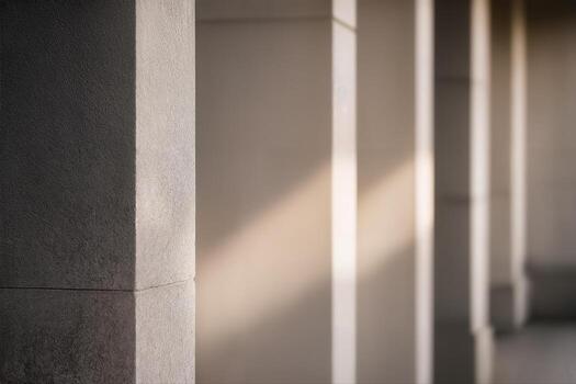 Monolithic Stone Colonnade in Soft Natural Light Featuring Repeated Pillars in an Outdoor Setting With Subtle Shadow Play and Architectural Symmetry photo