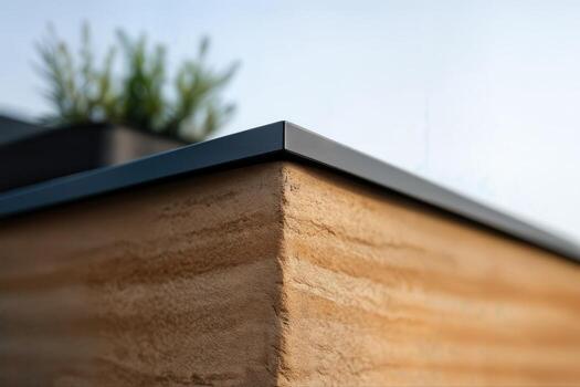 Modern Zinc Capped Edge Of Earthen Wall In Minimalist Architecture With Shallow Depth Of Field Creating A Sleek And Contemporary Outdoor Design photo