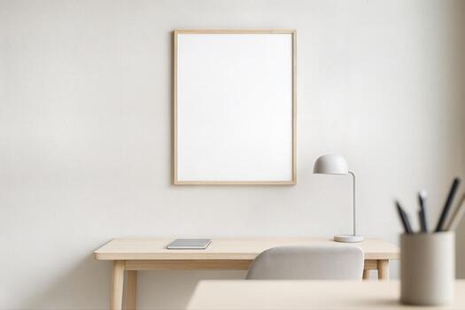 Minimalist Study Nook Featuring a Wooden Desk with a Tablet, a Clean White Frame on the Wall, and a Desk Lamp in a Bright Room with Neutral Tones photo