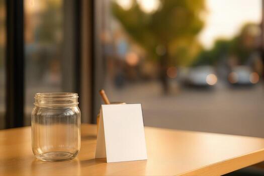 Empty Tip Jar on a Wooden Table Inside a Cozy Cafe with a Blurred Street View Outside Creating a Peaceful Atmosphere in the Late Afternoon Light photo