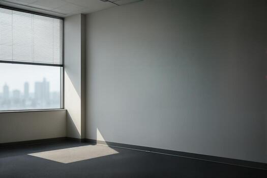Empty Office With Large Window Overlooking Cityscape, Featuring Closed Blinds Casting Shadows On Carpeted Floor On A Clear Day photo